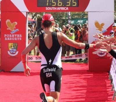 Winner Jodie Stimpson crosses the finish line at the Discovery World Triathlon Cape Town.(Photo credit: Jeff Ayliffe)